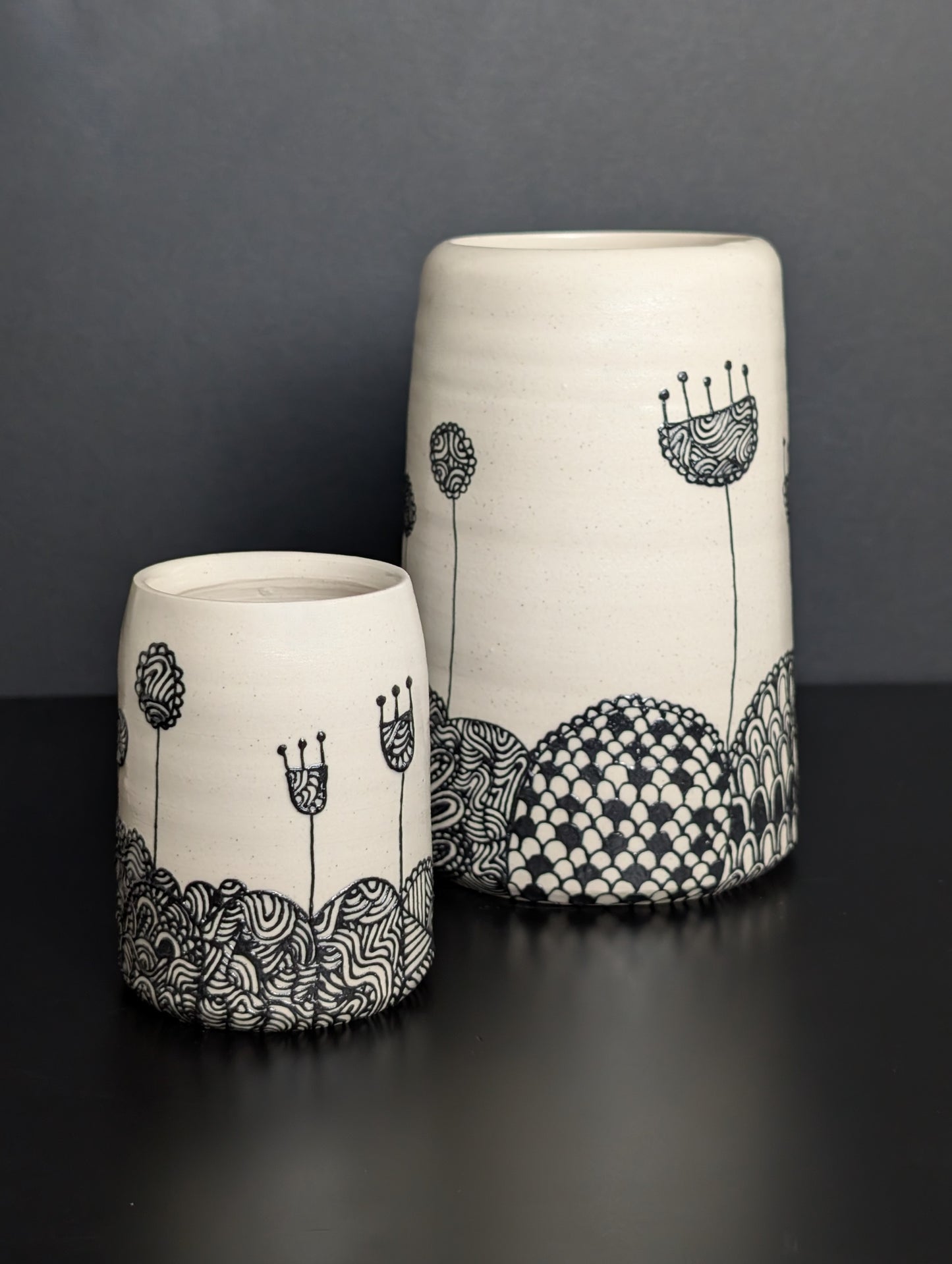 Black floral patterned landscape slip trailed group