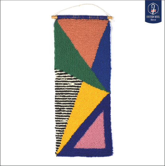 A contemporary hand punched miniature, using triangles, salmon pink, royal blue, green, yellow and pink block colours with an additional black and white stripe pattern to create a carefully balanced piece of wall art using British Wool and yarn from previous projects. 