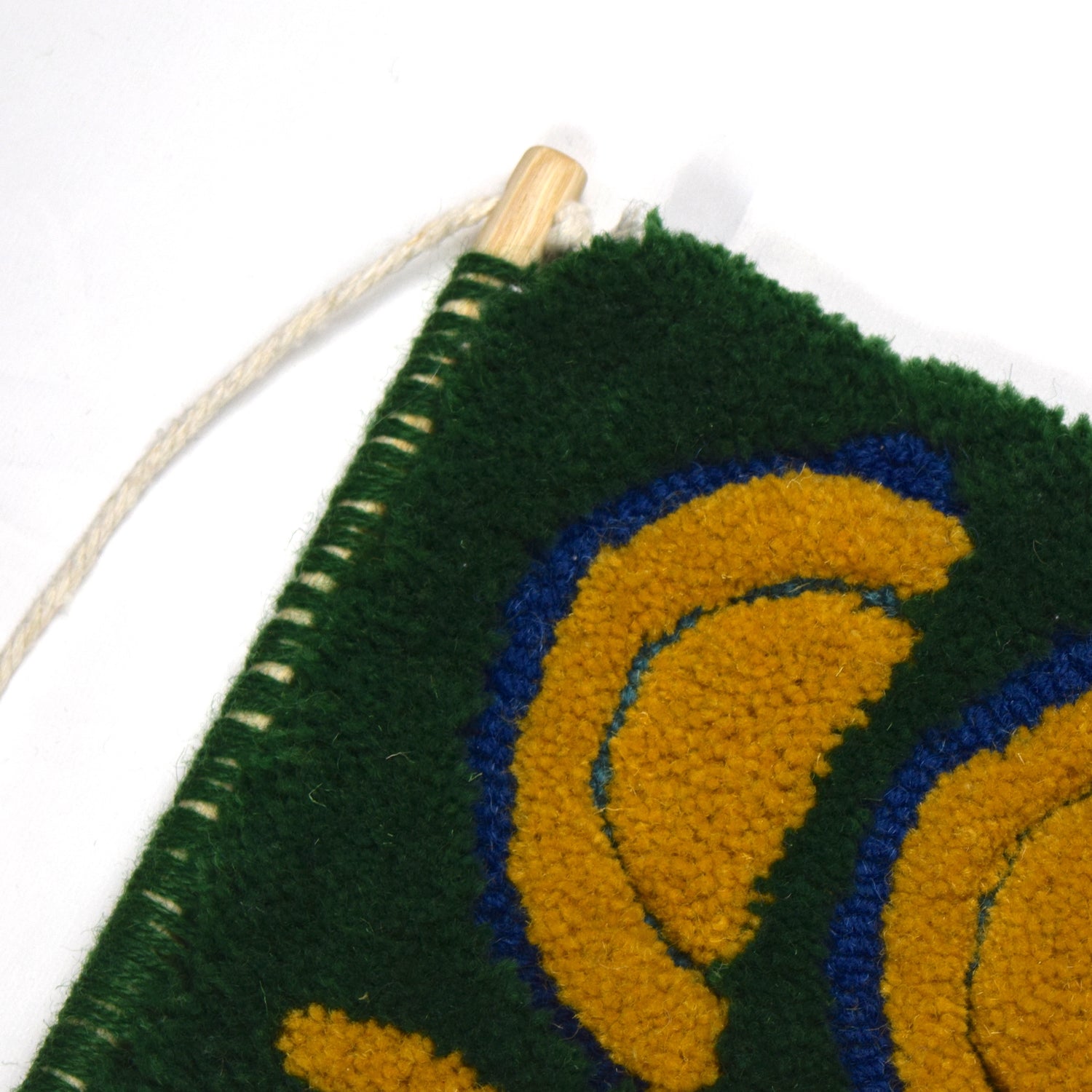 Green, Blue and Mustard - Hand Tufted Wall Hanging in a loop and cut pile using reclaimed yarns close up. 