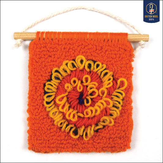 A hand punched miniature using British Wool, with a contemporary Ammonite spiral design. Using orange, blue, coral and yellow to create a carefully balanced Wall Hanging
