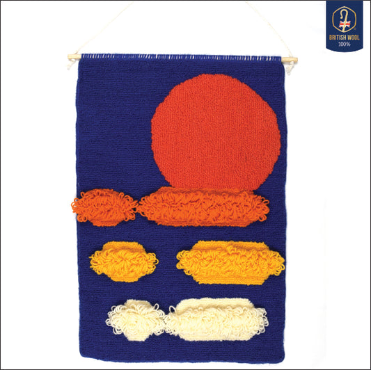 Using a simple circle and oblong shapes to create a contemporary sunset, hand punched using British Wool with a royal blue background, Coral circle, Orange, Yellow and Cream oblongs, with long loops in the centre. 