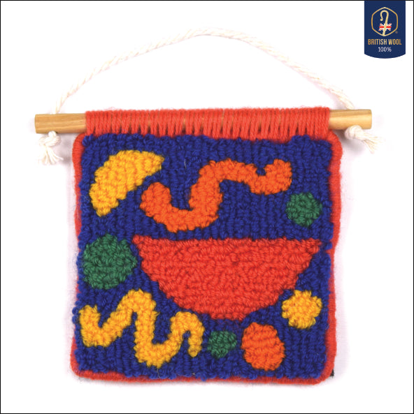 A hand punched miniature, using simple semi circles, circles and squiggle to create a carefully balanced wall hanging using British Wool. Royal Blue, Yellow, Orange, Green and Coral with Coral hand bound edges. 