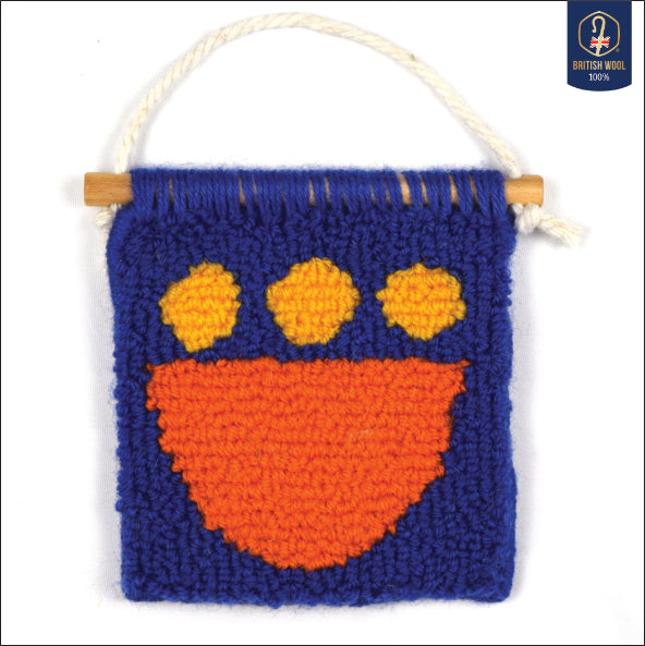 A contemporary hand punched miniature made using British Wool in royal blue, an orange semi-circle and yellow circles.