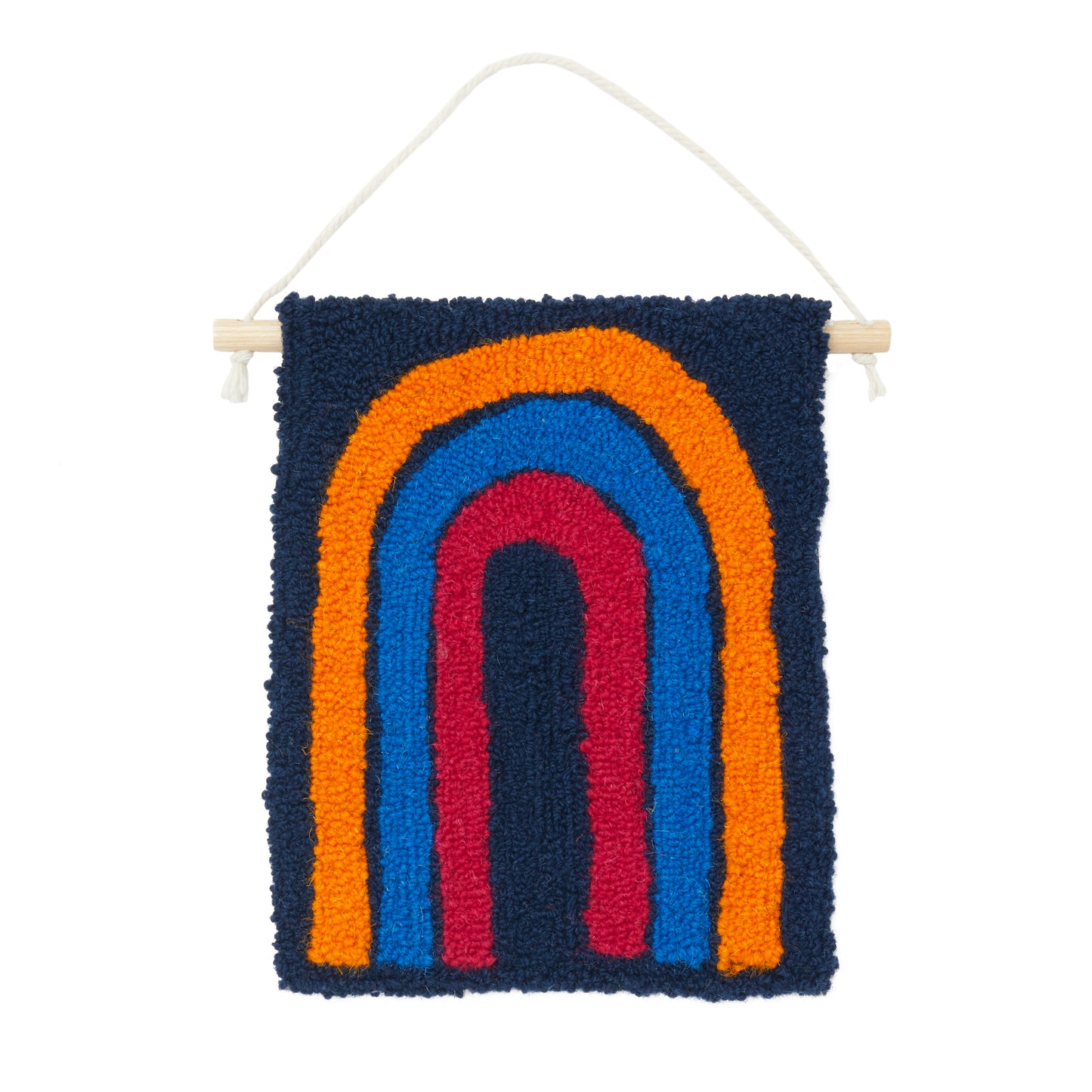 A loop pile tufted wall hanging in navy, orange, royal blue and magenta. This rainbow design has playful ‘illustrated’ edges.